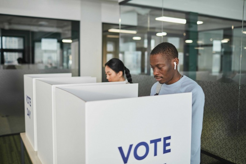 Stock image of two people voting.