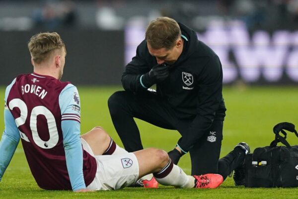 Jarrod Bowen receives treatment to his left foot during West Ham's defeat to Liverpool on Sunday