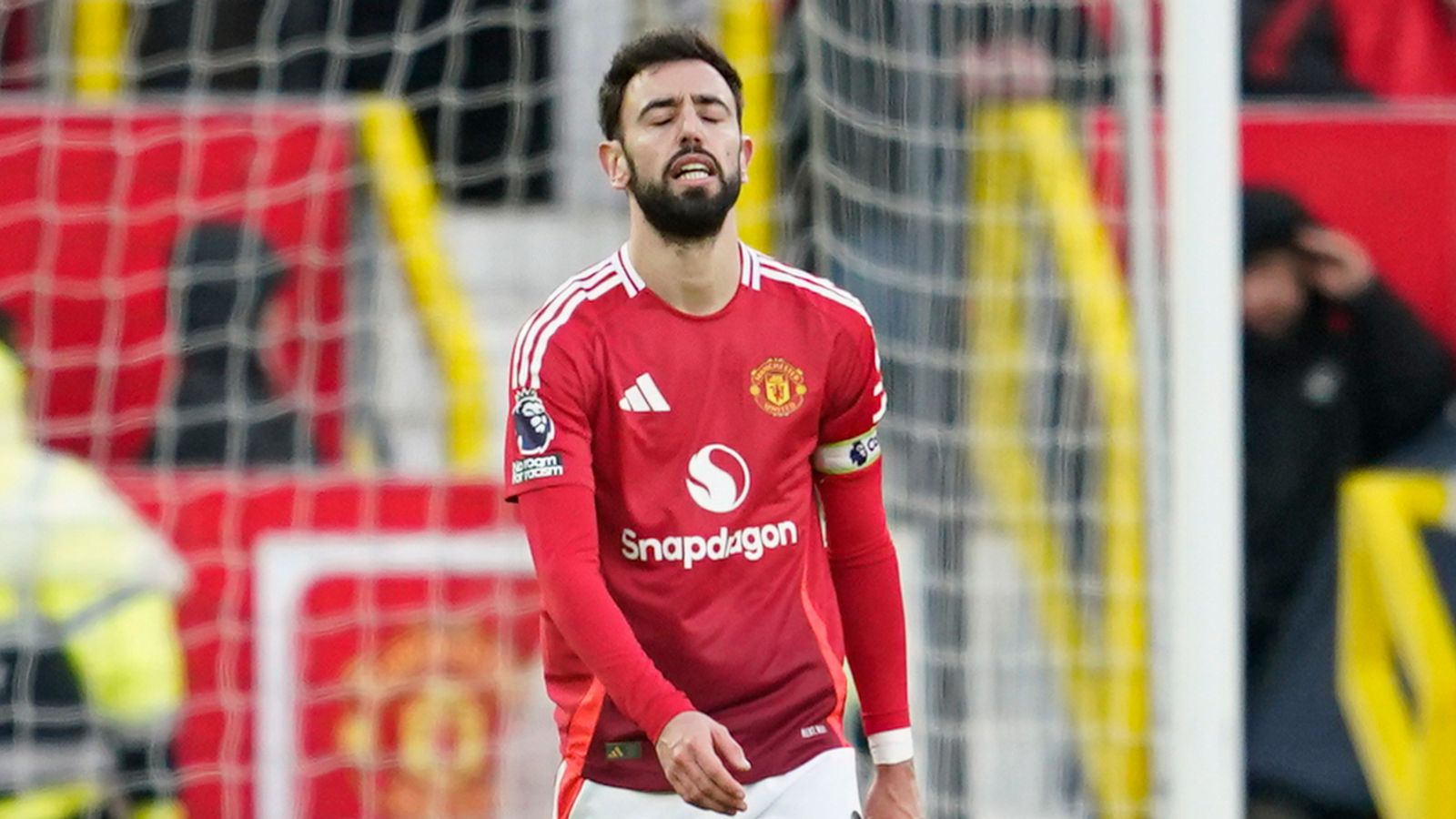 Manchester United's Bruno Fernandes is dejected after his team conceded a third