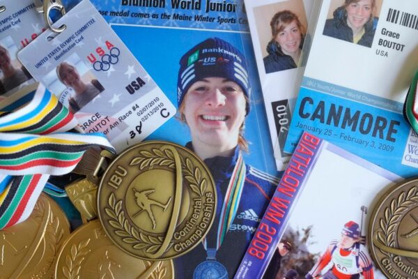 Biathlon competition medals, credentials, and media clippings belonging to Grace Boutot, silver medalist in Youth World Championships in 2009, are displayed for a photograph at her home, Oct. 17, 2024, in Boston. (AP Photo/Steven Senne)