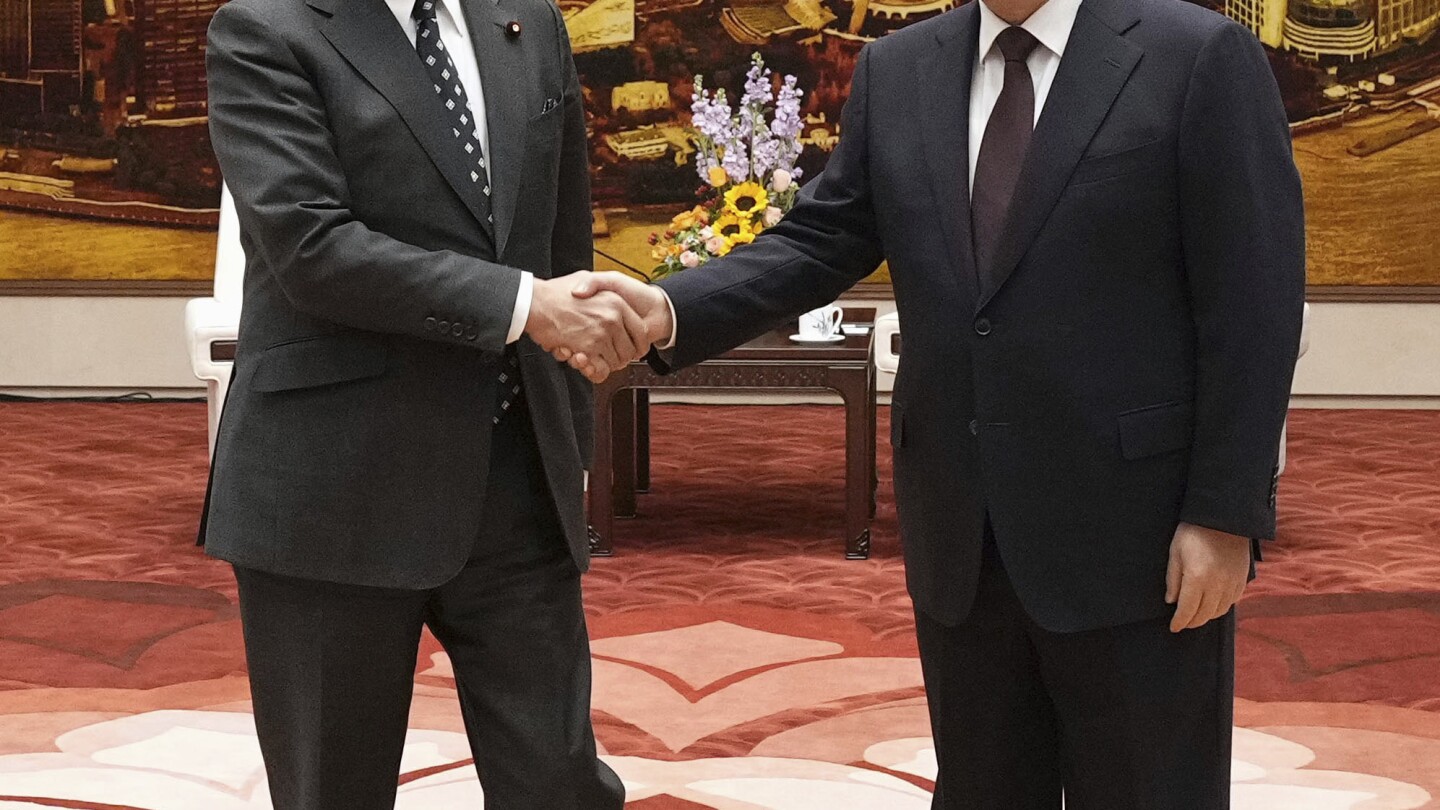 Japan's foreign minister seeks "positive" direction in bilateral ties during his visit to China