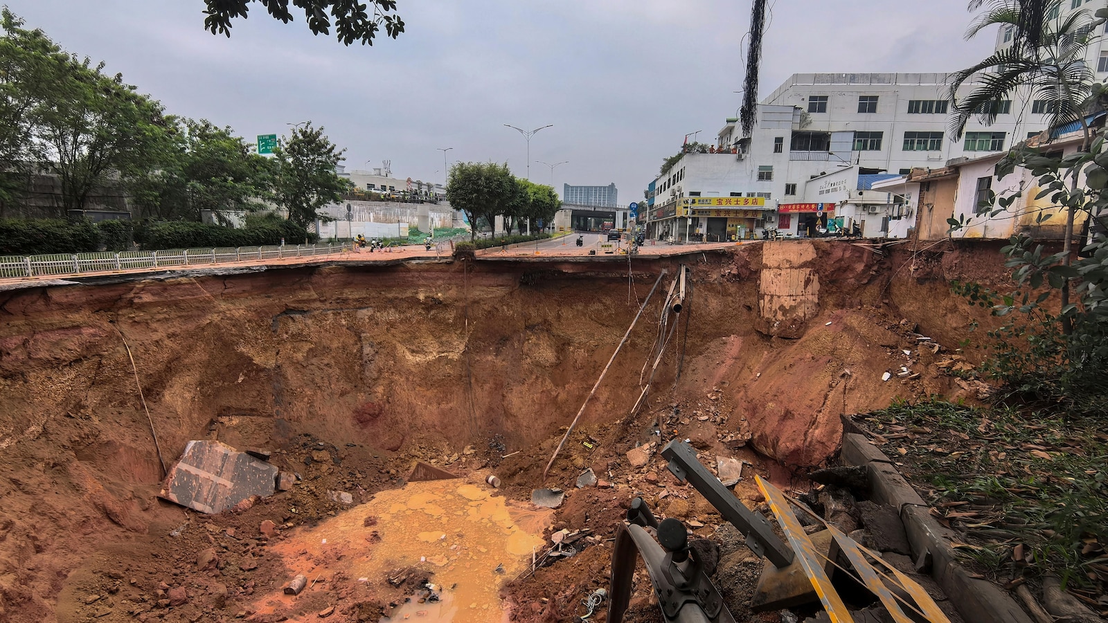 Rescuers search for 13 workers missing after a railroad construction site collapses in south China