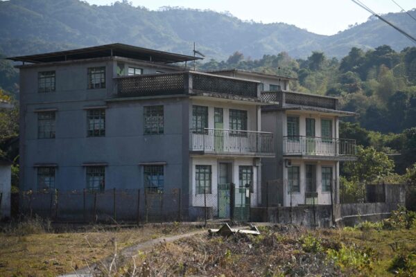 Photo taken on January 18, 2025 shows old village houses in the 300-year-old seaside Kuk Po village at the edge of Hong Kong as scores of visitors descend on the place as the city seeks to diversify its tourism offerings with glimpses of history and lush nature. Photo by Peter PARKS / AFP