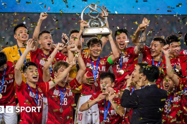 Guangzhou FC celebrating with the AFC Champions League trophy