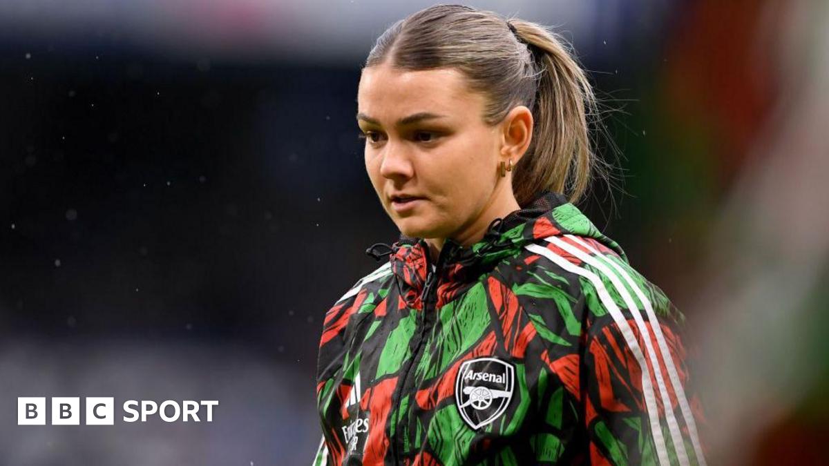 Laura Wienroither wearing an Arsenal training jacket