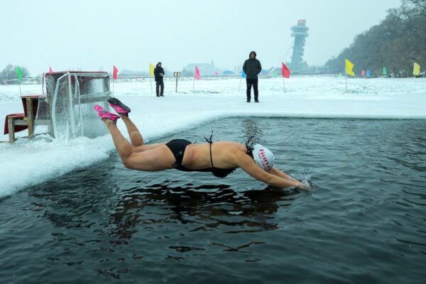 People in China Swim in Freezing River for Health, Happiness