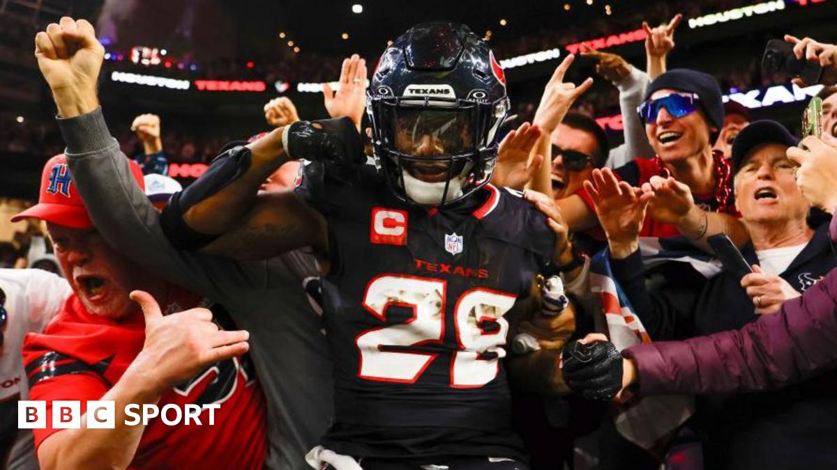 Joe Mixon celebrates scoring a touchdown against the Los Angeles Chargers, surrounded by Houston Texans fans