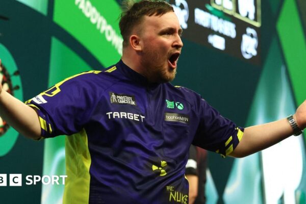 Luke Littler celebrates victory