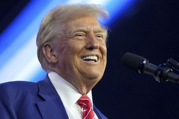 President-elect Donald Trump speaks at AmericaFest, Sunday, Dec. 22, 2024, in Phoenix. (AP Photo/Rick Scuteri)