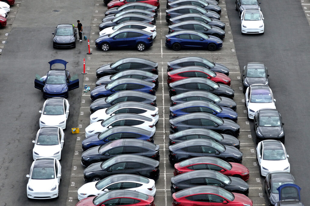 Workers prepare new Tesla cars for delivery at the company’s Fremont Factory in California on April 24, 2024. Credit: Justin Sullivan/Getty Images