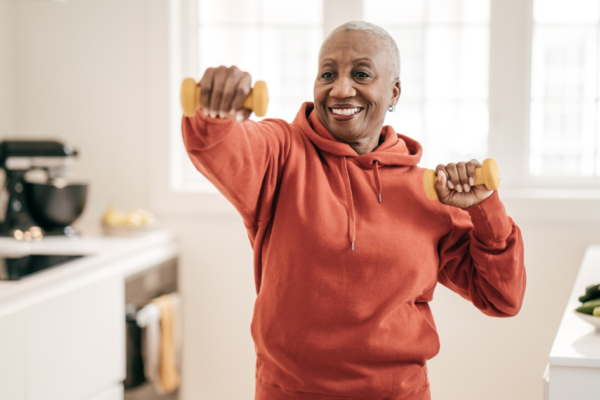 Woman with hand weights in her kitchen