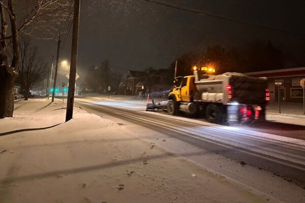 A snowplow passes through Lowville, New York, on Saturday, Jan. 4, 2025. (AP Photo/Cara Anna)