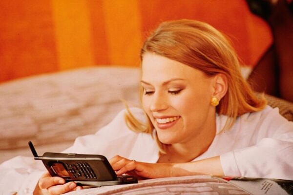 Woman using old cell phone in Nokia ad