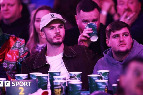 James Maddison watching darts