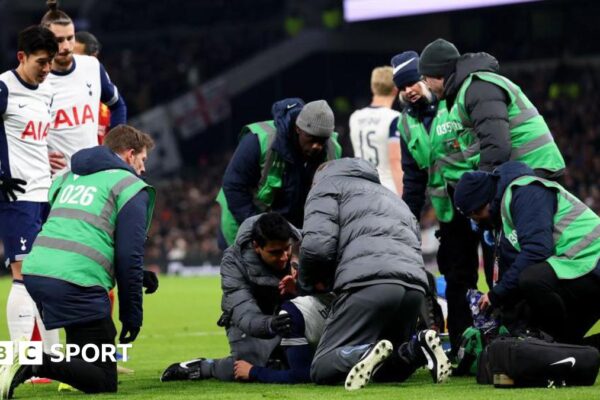 Rodrigo Bentancur receives treatment on the pitch in Tottenham's game against Liverpool