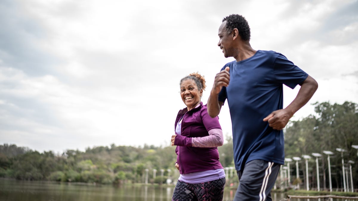 Couple running in park