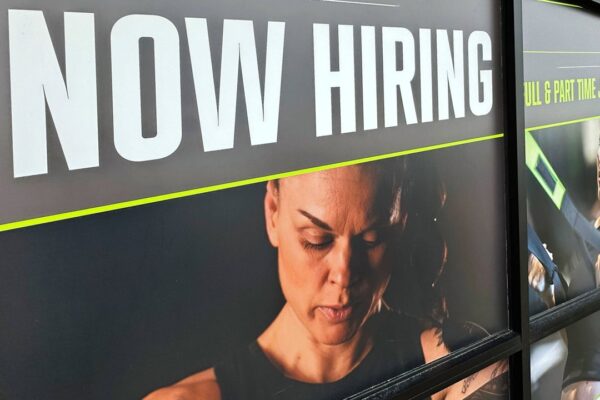 A hiring sign is displayed at a fitness center in Riverwoods, Ill., Sunday, Jan. 5, 2025. (AP Photo/Nam Y. Huh)