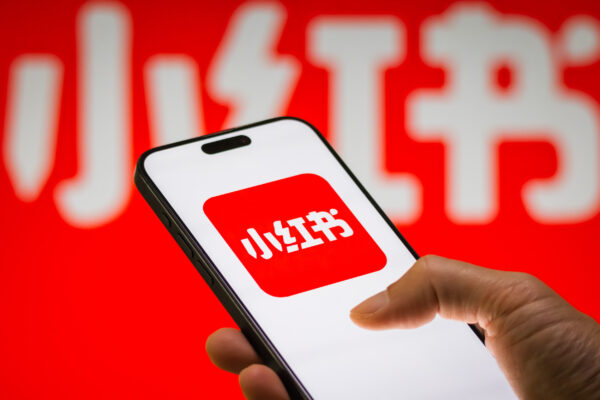 Phone Displays Xiaohongshu App Logo