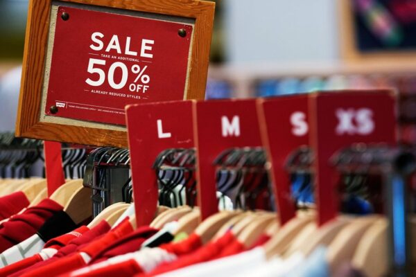 A sale sign is displayed on a rack of clothes at a store in Chicago, Monday, June 10, 2024. (AP Photo/Nam Y. Huh, File)