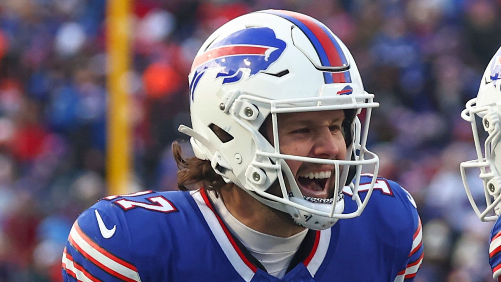 Buffalo Bills quarterback Josh Allen (17) celebrates with wide receiver Curtis Samuel (1)