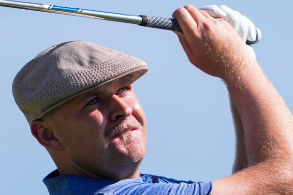 Harry Hall, of England, hits from the 17th tee during the second round of the Sony Open golf event, Friday, Jan. 10, 2025, at Waialae Country Club in Honolulu. (AP Photo/Matt York)