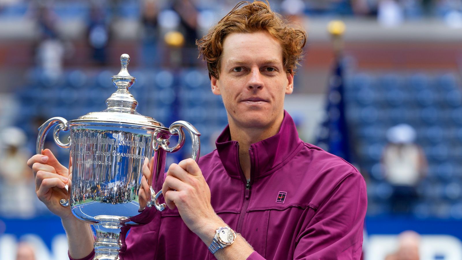 Jannik Sinner, of Italy, holds up the championship trophy after defeating Taylor Fritz, of the United States, in the men's singles final of the U.S. Open tennis championships, Sunday, Sept. 8, 2024, in New York. (AP Photo/Kirsty Wigglesworth)