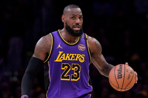 Los Angeles Lakers forward LeBron James dribbles during the first half of an NBA basketball game against the Atlanta Hawks, Friday, Jan. 3, 2025, in Los Angeles. (AP Photo/Mark J. Terrill)