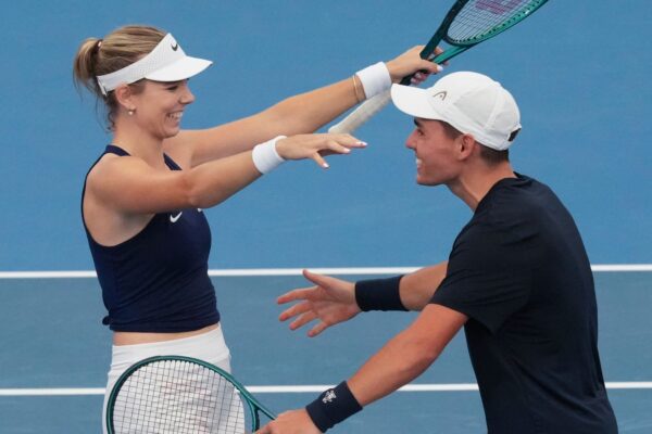 Britain's Charles Broom and Katie Boulter celebrate after defeating Argentina's Tomas Martin Etcheverry and Maria Carle in their mixed doubles match at the United Cup tennis tournament in Sydney, Australia, Monday, Dec. 30, 2024. (AP Photo/Mark Baker)