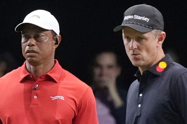 Tiger Woods of the Jupiter Links Golf Club watches his shot on the 10 green as Justin Rose of the Los Angeles Golf Club prepared to line his putt, Tuesday, Jan. 14, 2025, in Palm Beach Gardens, Fla. (AP Photo/Marta  Lavandier)