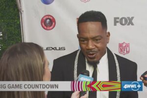 Devin Bartolotta interviews celebrities on the red carpet for the Super Bowl Soulful Celebration