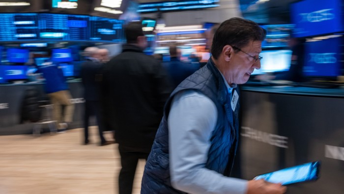 Traders work on the New York Stock Exchange