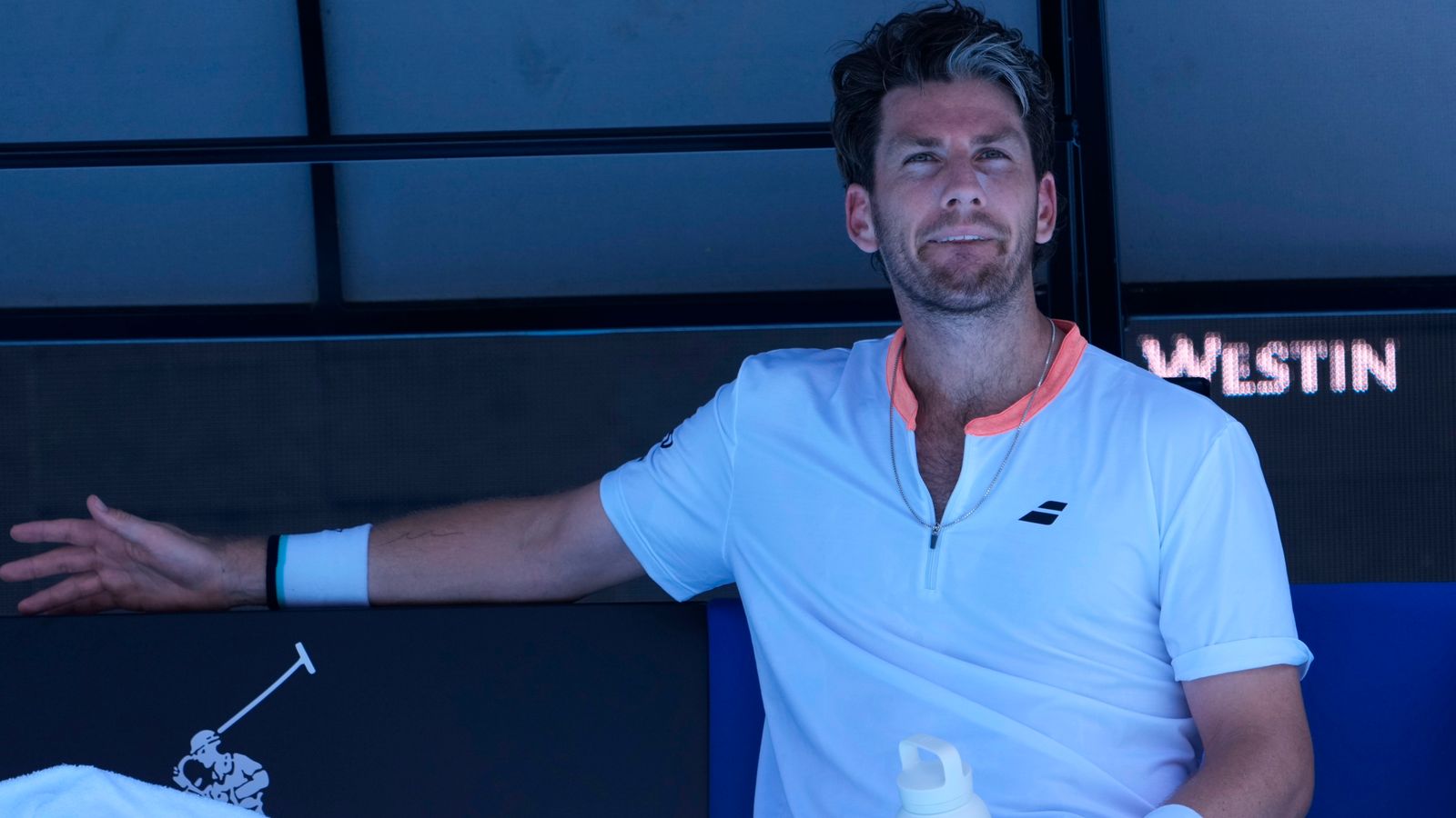 Cameron Norrie of Britain reacts during a break in his first round match against Matteo Berrettini of Italy at the Australian Open tennis championship in Melbourne, Australia, Tuesday, Jan. 14, 2025. (AP Photo/Asanka Brendon Ratnayake)
