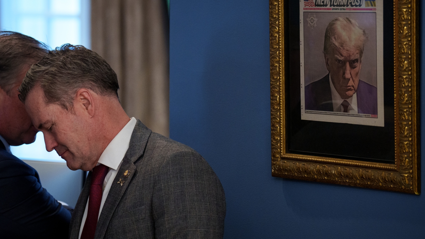 A gold-framed Trump mug shot is hanging just outside of the Oval Office : NPR