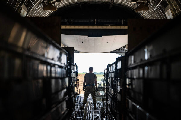 A Team Dover Airman loads weapons cargo bound for Ukraine onto a C-17 Globemaster III during a security assistance mission at Dover Air Force Base, Delaware