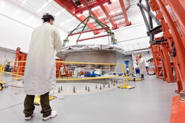 Bill Gates-backed Commonwealth Fusion Systems hits key reactor construction milestone Commonwealth Fusion Systems employees supervise the installation of the tokamak's cryostat base.