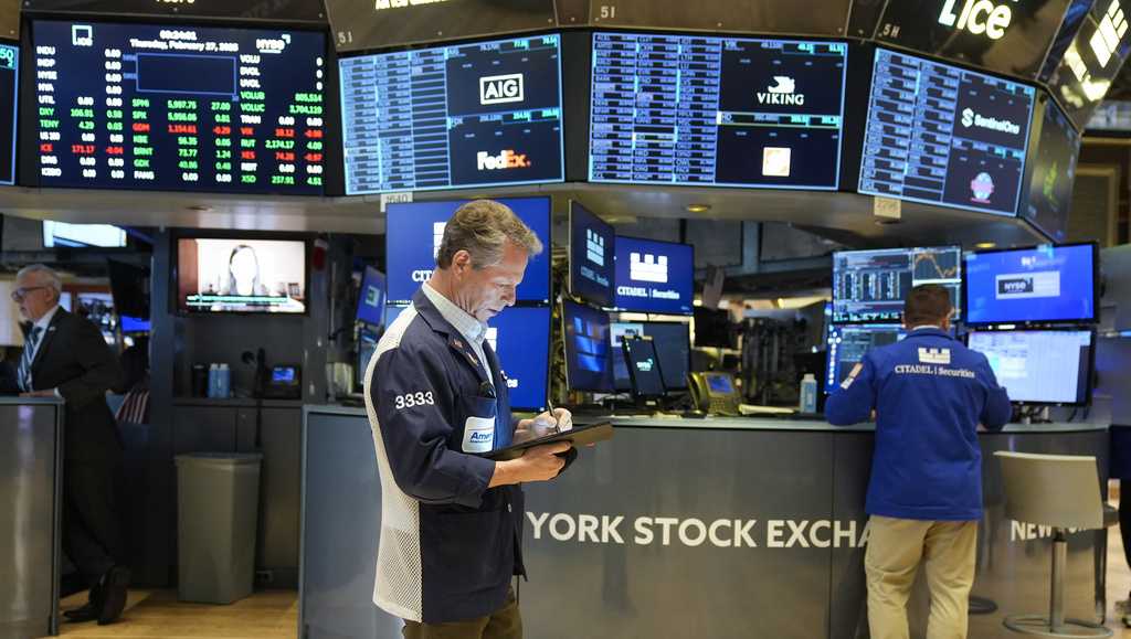 Dow drops nearly 650 points on worries that Trump's latest tariffs will slow the economy more