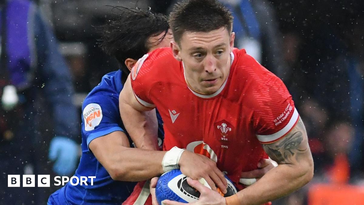 Wales' Josh Adams tries to escape a tackle against Italy