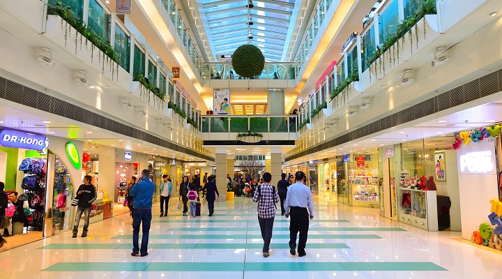 people walk inside a shopping mall in Hong Kong
