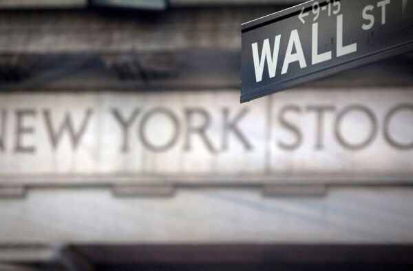 A Wall Street sign is pictured outside the New York Stock Exchange