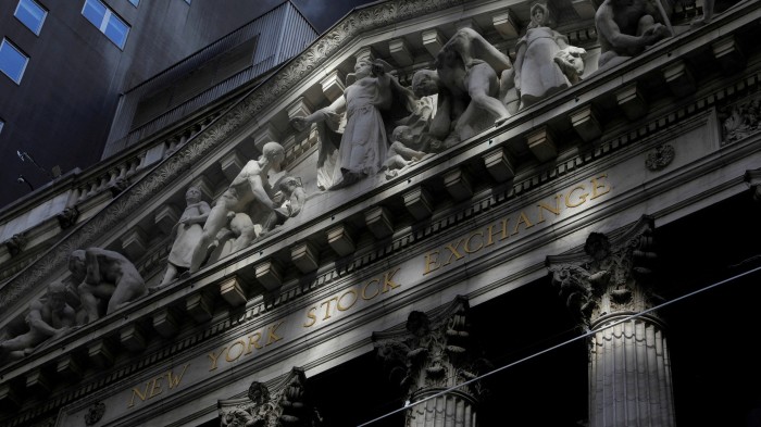 Morning sunlight falls on the facade of the New York Stock Exchange