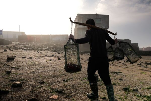 Man walking with the catch of the day