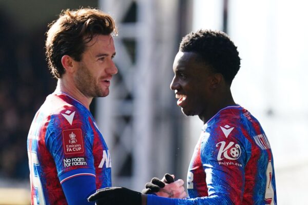 Eddie Nketiah (R) celebrates his goal against 10-player Millwall