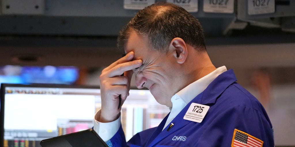 Photos Show Reactions at NY Stock Exchange Amid Trump's Tariffs