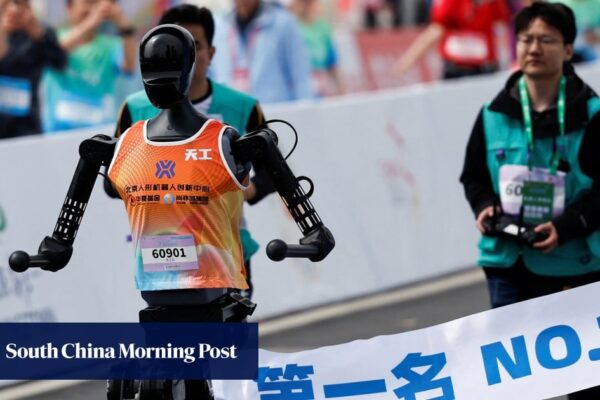 Running robots put through their paces alongside humans in Beijing half-marathon