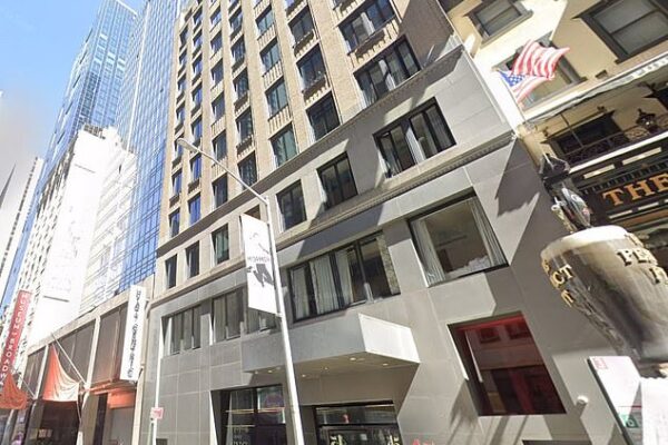 A man has plunged to his death from a Times Square hotel window as investigators work to determine whether it was a tragic accident or foul play