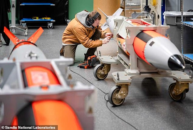 Workers prepare the B61-13, a nuclear 'gravity bomb' 24 times more powerful than the atom bomb dropped on Hiroshima, Japan in 1945