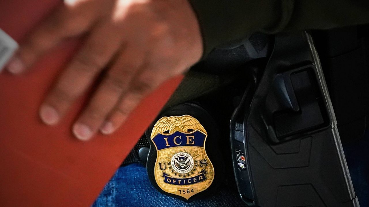 A deportation officer with Enforcement and Removal Operations in U.S. Immigration and Customs Enforcement's New York City field office conducts a brief before an early morning operation, Tuesday, Dec. 17, 2024. (AP Photo/Julia Demaree Nikhinson, File)