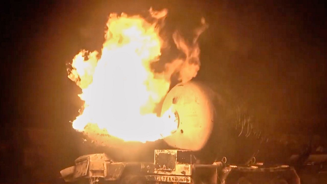 In this photo taken from video released by Al Masirah TV channel shows a burning oil tanker after U.S. airstrikes targeted the Ras Isa oil port held by Yemen's Houthi rebels in Hodeida, Yemen, Friday, April 18, 2025.( Al Masirah TV via AP)