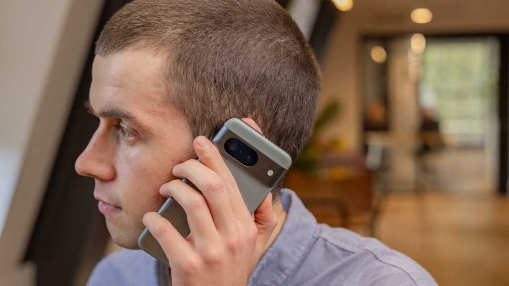A man using the Google Pixel 8 smartphone