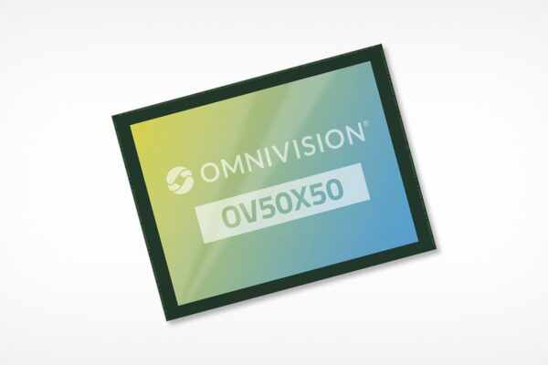 OmniVision’s New Smartphone Sensor Promises the Industry’s ‘Highest Dynamic Range’ A rectangular electronic chip with a gradient blue and yellow design. The words "OmniVision OV50X50" are printed on its surface. The image has a light gray background.